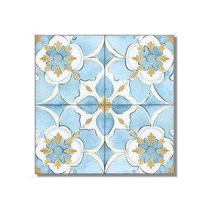 May include: Four square tiles with a repeating floral pattern. The design features light blue, white, and gold colors. Each tile has a central flower motif with petal-like shapes and a gold border.