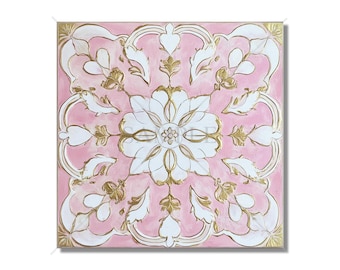May include: A pink square tile with a white and gold floral design. The tile has a raised, textured surface.