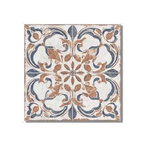 May include: A square ceramic tile with a white background and a blue and brown floral pattern. The tile has a distressed look, with faded colors and a slightly rough texture.