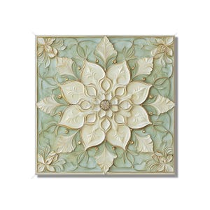 May include: A square, off-white floral relief sculpture with a central flower design and corner accents. The flower petals and leaves are detailed with gold accents, set against a pale green background. The artwork is framed with a light-colored border.