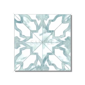 May include: A square tile with a blue and white geometric pattern. The pattern is reminiscent of a traditional Moroccan design. The tile is made of marble and has a smooth, polished finish.