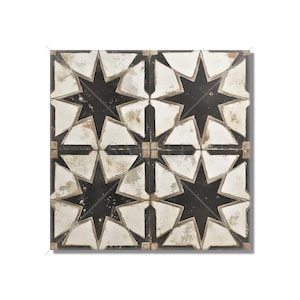 May include: Square tile with a repeating star pattern. The design features eight-pointed stars in white and gray against a black background. The tile has a distressed, aged appearance, with a border of small square tiles.