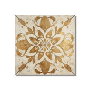 May include: Square wall art featuring a symmetrical floral design in gold and off-white. The artwork has a distressed, aged appearance, with gold leaf accents and a cream-colored background. The design is centered and radiates outwards.