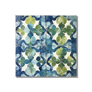 May include: Four square ceramic tiles with a blue and green floral pattern. The tiles are arranged in a square shape.