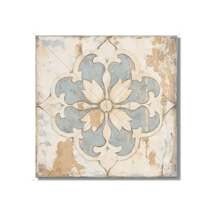 May include: A square canvas wall art featuring a distressed, vintage-style tile with a blue and white floral design. The tile has a faded, worn look, giving it a rustic charm.