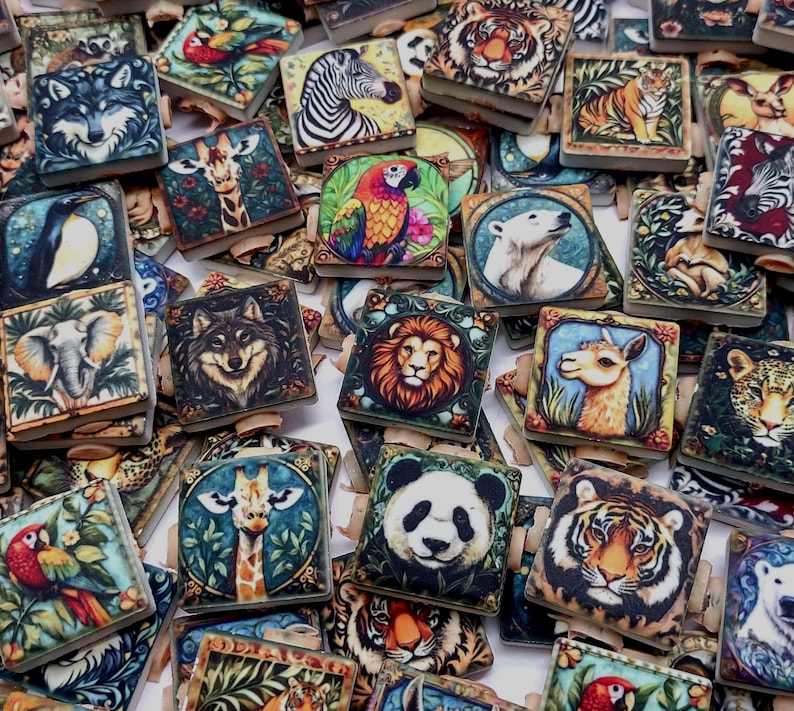 May include: A collection of square wooden clips featuring colorful illustrations of various animals including tigers, wolves, lions, pandas, giraffes, zebras, parrots, elephants, and polar bears, arranged in a dense, overlapping pile.