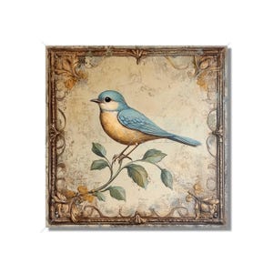 May include: A bluebird with a yellow breast perched on a branch with green leaves. The bird is surrounded by a decorative gold frame on a beige background.