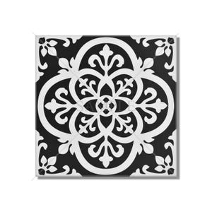 May include: Black and white ceramic tile with an intricate floral pattern. The tile has a square shape and a glossy finish.