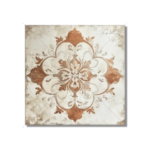 May include: Square decorative tile with a distressed, aged appearance. The tile features a symmetrical, floral-inspired design in shades of brown and cream. The design is centered and surrounded by a textured, off-white background, creating a vintage aesthetic.