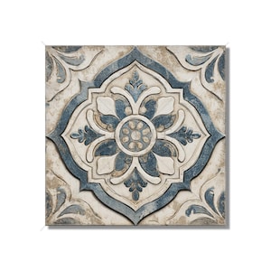 May include: Square tile with a floral design in shades of blue and white. The tile has a distressed, aged appearance, with a central flower motif surrounded by ornate, symmetrical patterns. The color palette includes muted blues, off-white, and hints of beige.