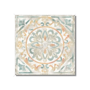 May include: A square tile with a distressed, white background and a teal, orange, and yellow geometric pattern. The pattern features a central circle with a four-pointed star design.