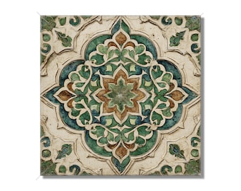 May include: Square tile with an intricate floral design. The tile features a central starburst pattern in shades of green and brown, surrounded by blue and green floral motifs, all set against a cream-colored background with a textured appearance.