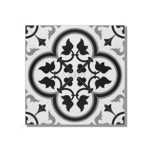 May include: Black and white patterned tile with a floral design. The tile has a square shape and features a repeating pattern of leaves and swirls.