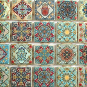 May include: A set of 16 ceramic tiles with intricate geometric patterns in shades of blue, green, red, and gold. The tiles feature a variety of designs, including hamsa hands, floral motifs, and abstract patterns.