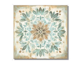 May include: A square canvas print with a blue, brown, and white mandala design. The mandala features a central flower with intricate details and is surrounded by a repeating pattern of leaves and swirls.