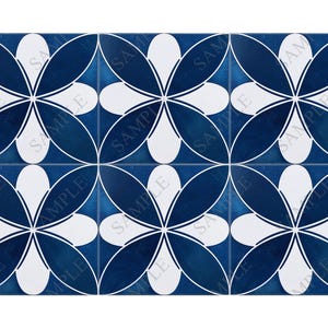 May include: A blue and white tile with a repeating pattern of stylized flowers. The tile has a textured, slightly distressed look.