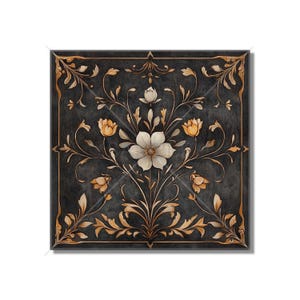 May include: A square black and gold floral design with a white flower in the center. The design is intricate and detailed, with swirling vines and leaves.