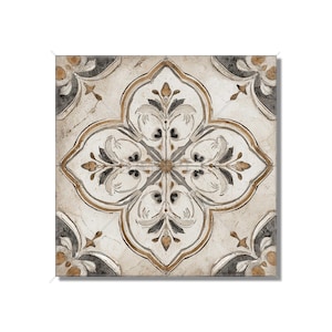 May include: Square decorative tile with a floral pattern. The tile features a central four-petal design in shades of beige, gray, and gold, with a distressed, aged appearance. The corners have a darker gray and gold accent.