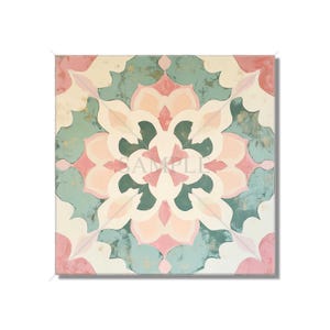 May include: Square canvas art featuring a symmetrical floral design in shades of pink, teal, and cream. The artwork has a distressed, vintage look with gold accents, creating a decorative and artistic piece for home decor.