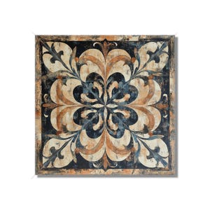 May include: A square tile with a decorative floral pattern in shades of brown, beige, and blue on a black background.