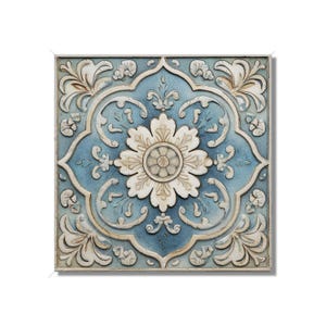 May include: Square wall art with a floral design. The artwork features a central white flower with a detailed pattern, surrounded by a light blue background and ornate white scrollwork. The piece has a distressed, aged appearance.