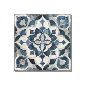 May include: A square tile with a blue and white geometric pattern. The pattern is intricate and features a central motif of a four-pointed star.