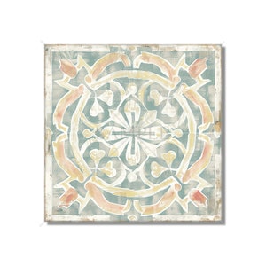 May include: A square tile with a geometric pattern in shades of blue, yellow, and orange. The tile has a distressed, vintage look.