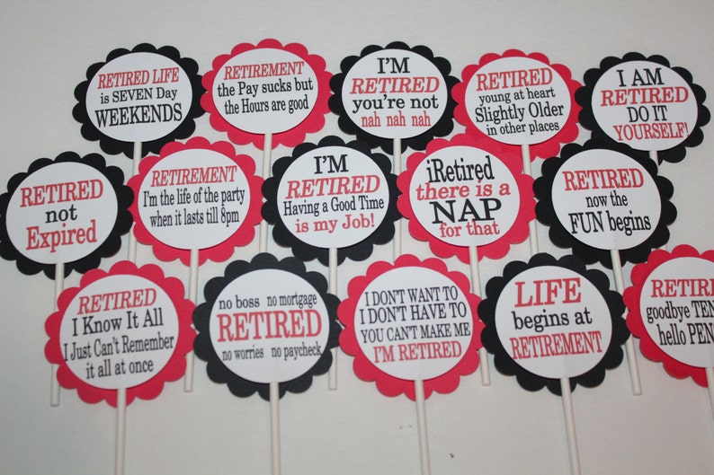 May include: A collection of retirement-themed party decorations. Each decoration is a round, scalloped-edged sign with a white center and red or black borders. Text in red and black font includes phrases like "Retired Life" and "I'm Retired."