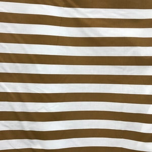 May include: Brown and white striped fabric with a subtle texture. The fabric is folded and has a slight wrinkle.