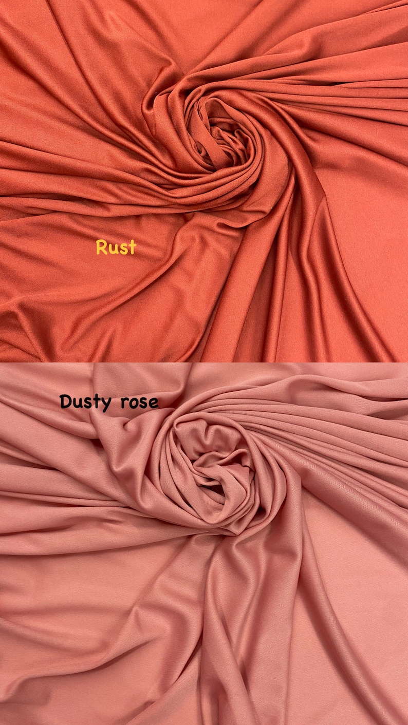 May include: Two fabric swatches, one rust orange and one dusty rose, are draped and folded to show the texture of the fabric.