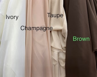May include: Four fabric swatches in different shades of beige and brown. The swatches are labelled "Ivory", "Champagne", "Taupe", and "Brown".
