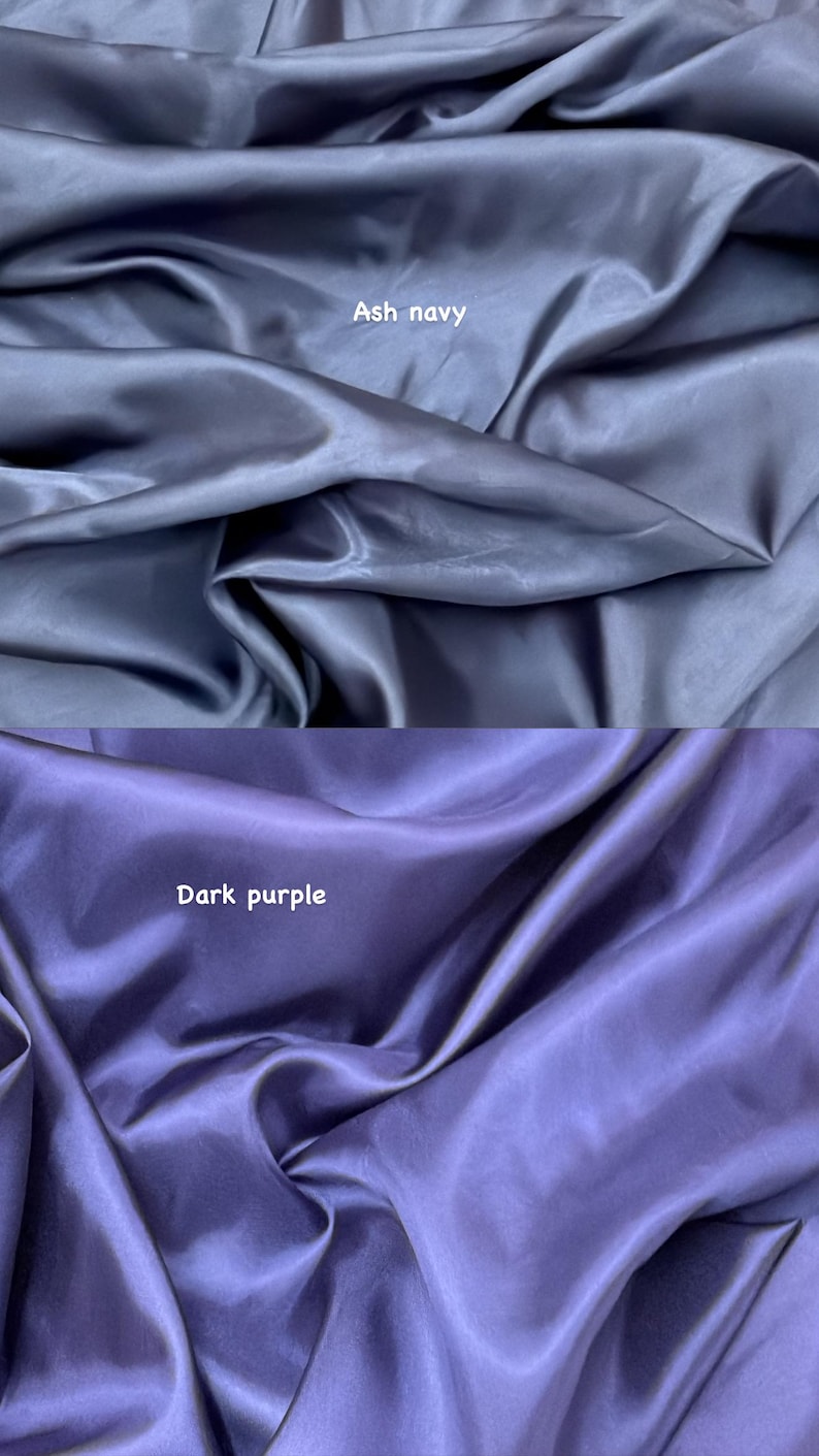 Puede incluir: Dos secciones de tela, una azul marino ceniza y otra morada oscura. Las telas tienen un brillo sedoso, satinado, con pliegues y arrugas visibles. El texto "Ash navy" y "Dark purple" son visibles.