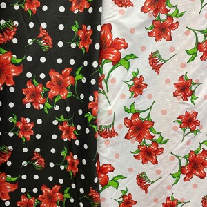 May include: Two fabric samples, one black with white polka dots and the other white with pink polka dots. Both feature a repeating pattern of red lilies with green leaves and stems. The fabric is likely suitable for apparel or home decor.
