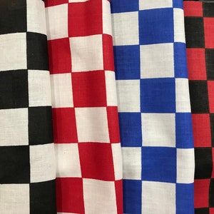 May include: Four fabric swatches with a checkered pattern. The swatches are black and white, red and white, blue and white, and red and black.