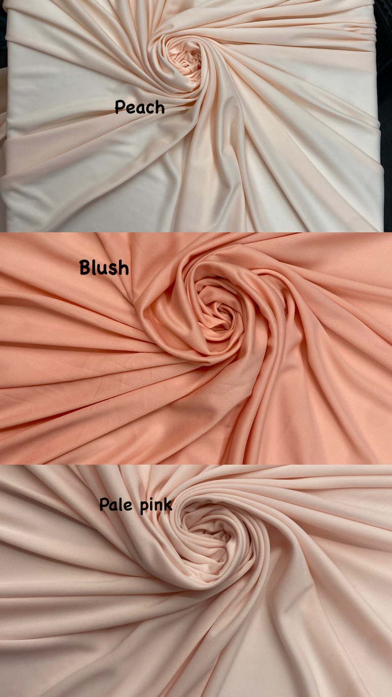 May include: Three swatches of fabric in different shades of pink: peach, blush, and pale pink. Each swatch is arranged in a spiral shape.