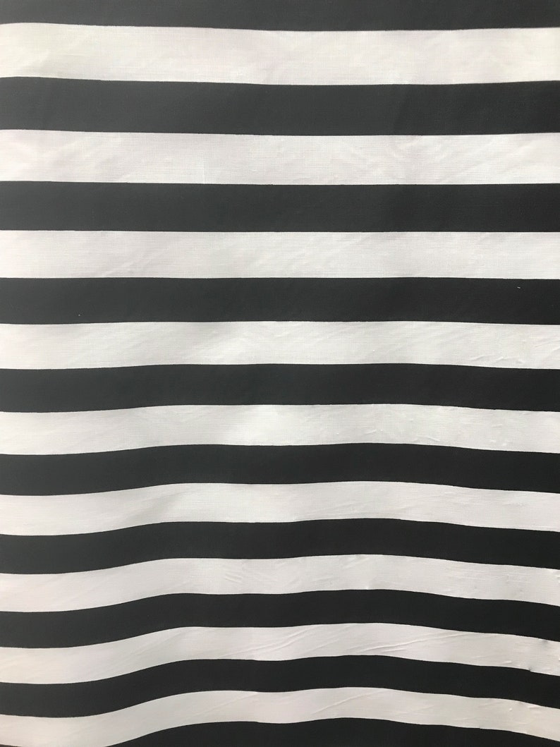 May include: Black and white striped fabric with a subtle wave pattern.