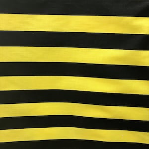 May include: Yellow and black striped fabric. The fabric has a smooth, shiny texture.