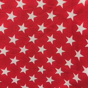 May include: Red fabric with a white star pattern. The stars are evenly spaced and arranged in a diagonal pattern.