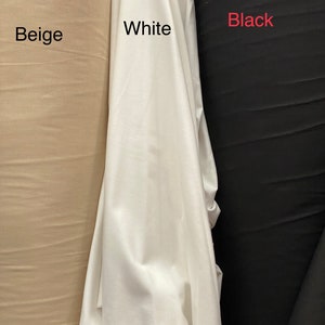 May include: Three fabric swatches in beige, white, and black. The swatches are labeled with their respective colors.