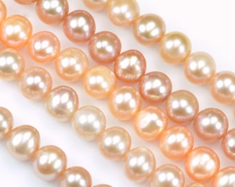 May include: A collection of round, lustrous peach-colored pearls arranged in multiple parallel strands. Each individual pearl features a smooth, reflective surface with subtle variations in tone, ranging from soft apricot to light salmon hues.