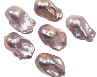 May include: Six iridescent baroque pearls in shades of pink and lavender. The pearls are irregular in shape and have a smooth, glossy finish.