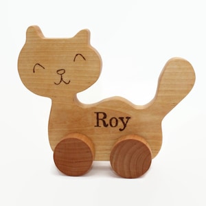 Wooden toy cat on wheels. Natural. Wooden toys. Animals. Gift for a boy or girl.