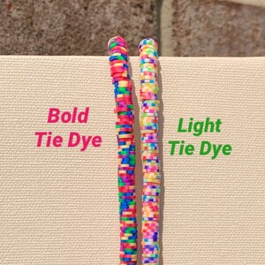 May include: Two strands of colourful tie dye beads, one with bold colours and one with lighter colours. The beads are arranged vertically and labelled "Bold Tie Dye" and "Light Tie Dye".