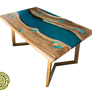 Resin dining table with glowing inlay and turquoise river
