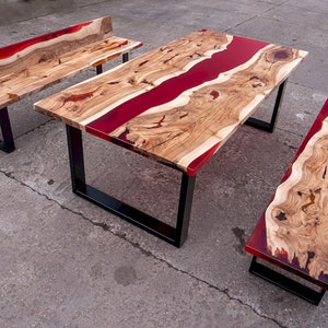 Dining table with red resin river and two benches, semi transparent, black powder coat legs