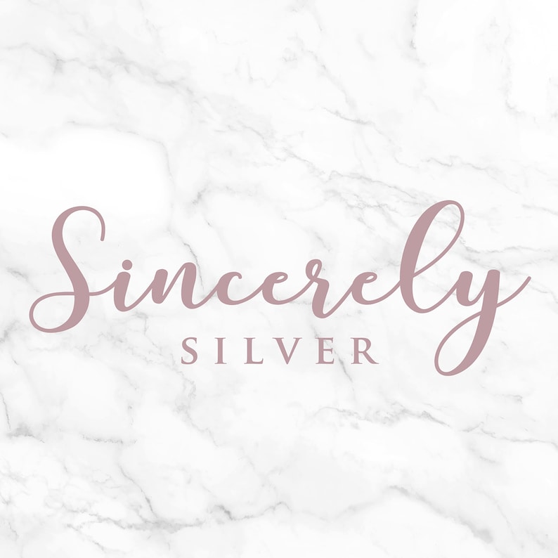 May include: The words "Sincerely Silver" in a mauve script font are centered on a white marble background. The word "Sincerely" is in a cursive font, and "Silver" is in a sans-serif font.