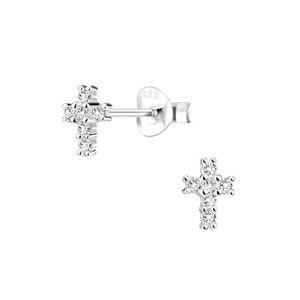 May include: A pair of silver cross stud earrings with small clear cubic zirconia stones.