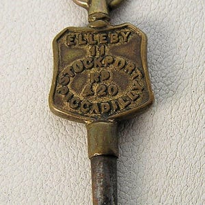 Reloj de bolsillo con cartel publicitario de la antigua Inglaterra, llave de cuerda, Elleby Piccadilly 33