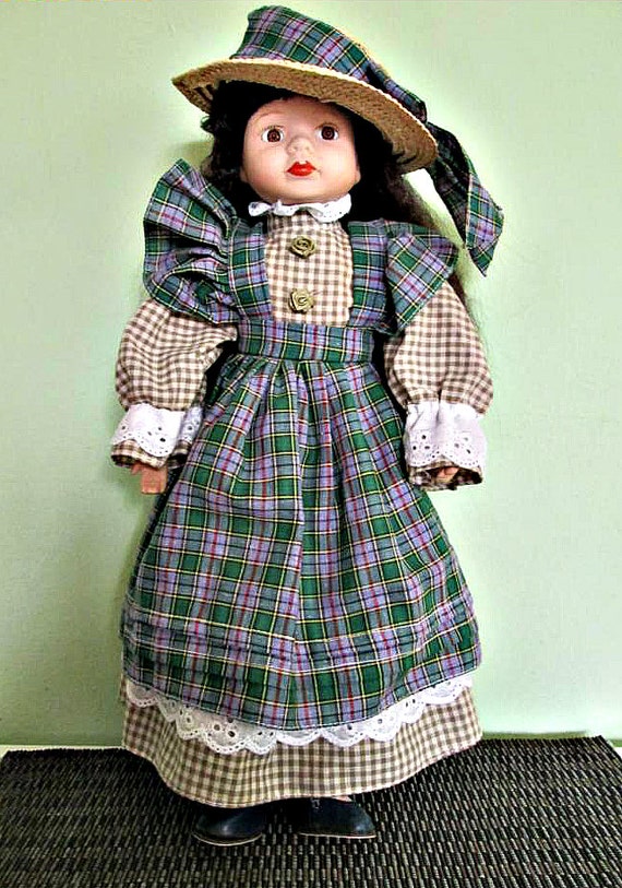 Collectible porcelain doll Black hair green dress Home | Etsy