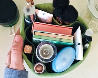 Small bathroom storage idea. Portable bathroom organizer with many pockets.  Eco-friendly organic canvas. Perfect for makeup and toiletries.